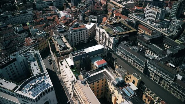 Aerial view of the Borsa Piazza Affari. Krishi houses in the city. Attractions for tourists. A crisis. Statue of the middle finger on the hand. Finance. Architecture. Italy, Milan, 12.12.2023