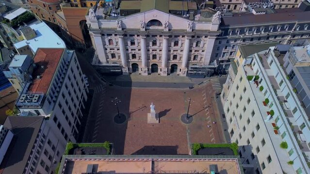 Aerial view of the Borsa Piazza Affari. Krishi houses in the city. Attractions for tourists. A crisis. Statue of the middle finger on the hand. Finance. Architecture. Italy, Milan, 12.12.2023