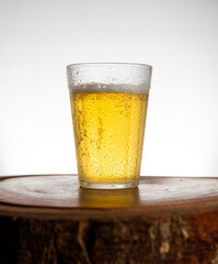 Glass of light beer on typical brazilian cup (americano long drink). - obrazy, fototapety, plakaty