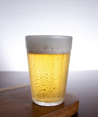 Glass of light beer on typical brazilian cup (americano long drink).