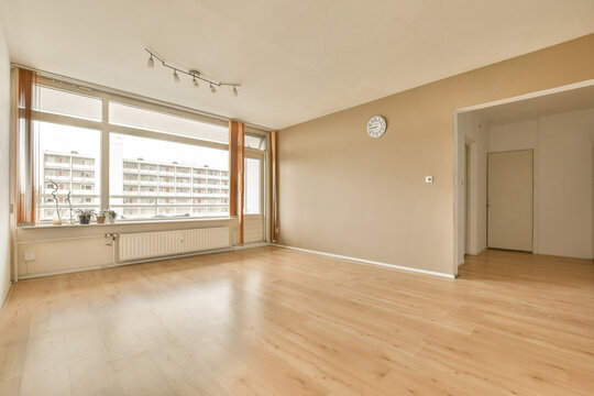 Empty living room with hardwood floor and window