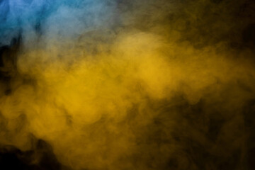 Blue and yellow steam on a black background.