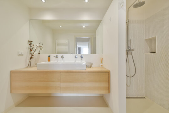 Modern bathroom interior with wooden elements