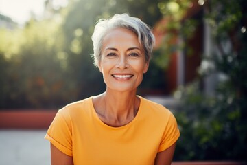 Portrait of a grinning woman in her 60s wearing a sporty polo shirt against a serene meditation room. AI Generation