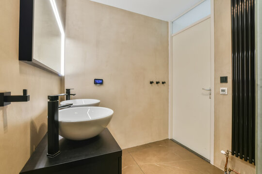Fototapeta Modern bathroom with stylish basin and minimalist design