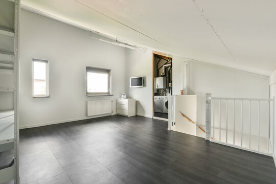 Spacious modern interior of a bright attic room