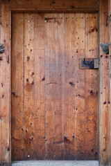 Fototapeta na wymiar Old small door of rural barn or shed close up texture