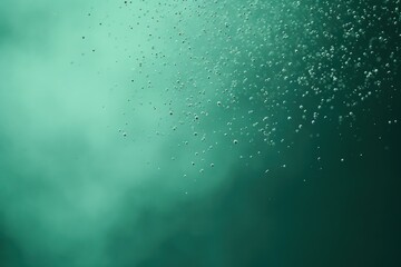  a close up view of water bubbles on a green and blue background with a small amount of bubbles on the bottom of the image 
