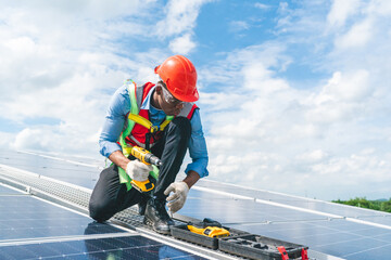 Male professional engineer installing solar photovoltaic panel system, Electrician mounting blue...