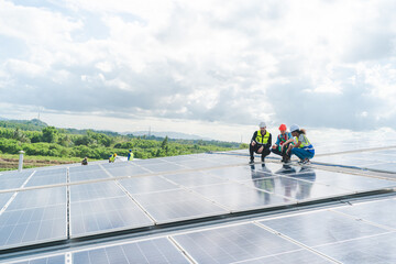 Male engineering teams install solar panels at solar power generating station, Professional...