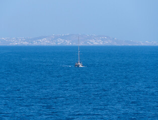 Beautiful yachts on the calm Aegean Sea on Mykonos island in Greece