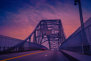 The Bourne Bridge at sunrise on Route 28 across Cape Cod Canal, connecting Cape Cod with the...