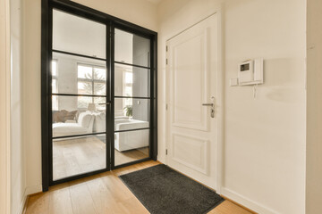 Living room with white walls and glass door