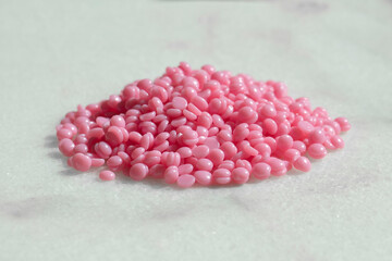 Hard wax beans on a marble table