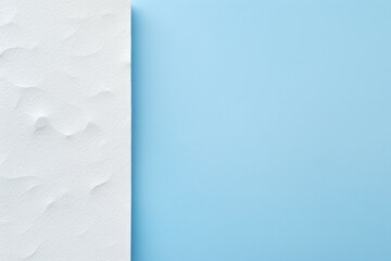 a blue and white paper with a white corner on the left and a white corner on the right on a blue background with a white corner on the right side.