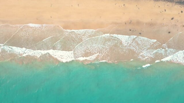 Summer seascape beautiful waves, blue sea water in sunny day. Esquinzo beach, Spain, Canary Island Top view from drone. Sea aerial view, tropical nature Beautiful bright sea waves splashing 