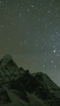 Milky Way and Starry Night Sky over Ama Dablam Mountain. Himalaya, Nepal. Timelapse. Vertical Video