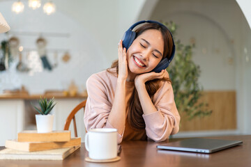 Portrait of smiling beauty asian woman happy and relax listening to music with headphones and...