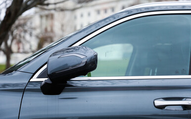 reflection in car mirror, conveying introspection and perspective in a fleeting moment of travel