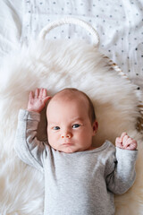 Portrait of 2 weeks old baby. Newborn baby at first months of life.