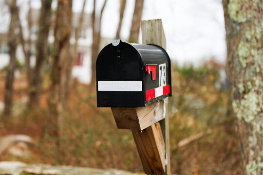 mailbox outside suburban home, symbolizing communication and connection