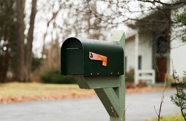 mailbox outside suburban home, symbolizing communication and connection