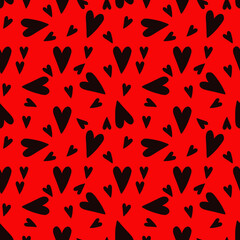 Seamless pattern of black hearts of different sizes chaotically on a red background