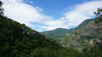 Fototapeta na wymiar The stunning mountain view from a hiking trail in Aixirivall in Andorra, in the month of June
