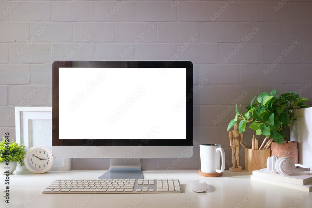 Poster front view of comfortable working space with computer, books and stationery on table.