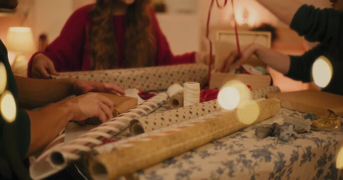 Friends wrapping Christmas presents together