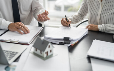 Business people signing contract making deal with real estate agent Concept for consultant home...