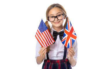 Schoolgirl, girl in glasses, with UK and USA flag, studio shot isolated on white background. Let's learn English.