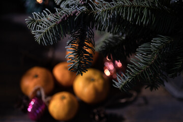 New Year's, festive background with tangerines, Christmas tree and Christmas tree decorations