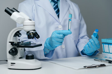 Scientists conducting research investigations in a medical laboratory. Scientist wearing medical...