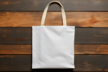 Mock-up of a white cloth bag on a wooden background - obrazy, fototapety, plakaty