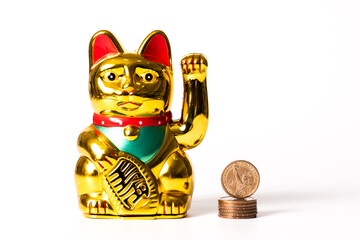 Classic Chinese cat figurine bringing financial prosperity and 1 US dollar coin