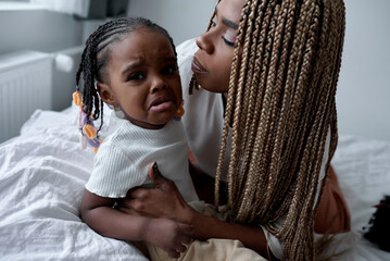 naughty little kid with dreads requires special attention.girl demands cuddling, kissing, more fuss...