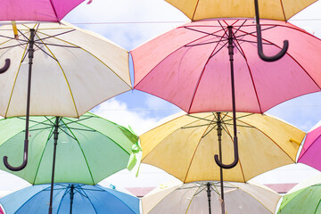 umbrellas of many colors hanging one after another for decoration