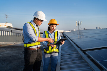 solar farm concept A team of engineers inspects the operation of the system. Renewable energy for...