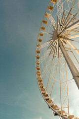 ferris wheel on a blue sky - 695484674