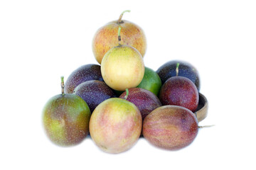 isolated passion fruit on white background. The passion fruit has an oval shape, a thick, oily rind. There are many seeds inside the fruit. It is a healthy fruit with high fiber content.  