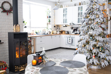 Christmas decor in white kitchen with burning stove fireplace, festive mess, village interior with...
