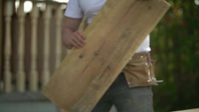 wood processing. the man takes the board. the man takes the board. slow motion video. High quality video in FullHD format.