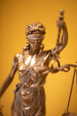 Themis and gavel in court library