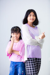 Asian sisters and sisters isolated white background,Two Asian women, white background