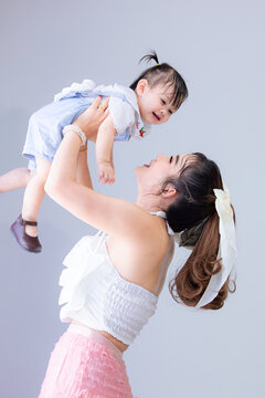 Asian Mother And Child,Asian Mother Playing With Her Baby At Home