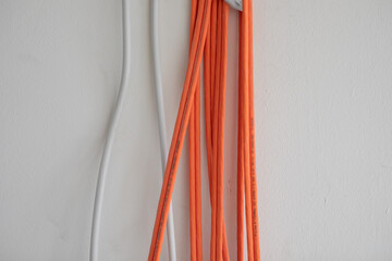 Orange cables in a rack ready for wiring..