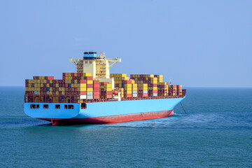 Container ship standing on the anchor.