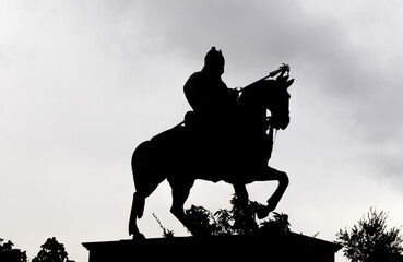 backlit shot of indian warrior maharana pratap statue at day from unique perspective