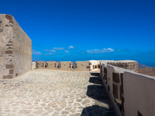 Detail view. The castle of Santa Barbara on the volcanic hilltop of Guanapay mountain.Teguise,...